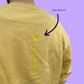 Senffarbener Sweater mit hellgelbem Print "Teilhabe statt Machtgehabe"